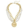 A multi-strand white turquoise necklace with a gold-plated bee pendant, designed by Susan Shaw.
