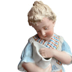 Rare matched pair of antique Gebrüder Heubach bisque figurines of a girl and boy enjoying sweets. Exquisite German craftsmanship, circa 1900.