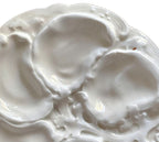 Rare 19th century French Limoges oyster plate in all-white relief porcelain. Elegant antique French tableware for collectors and refined display.