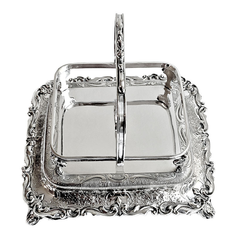 
Ornate antique Mappin &amp; Webb silver-plated sardine server with cut crystal liner and scrolled feet. A rare, collectible English tableware piece.
