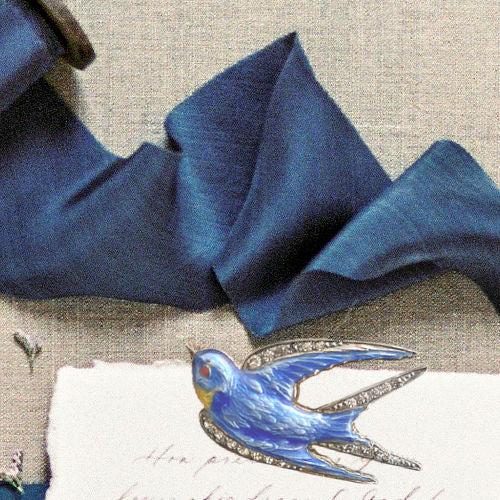 Rare Paye & Baker sterling silver swallow brooch with guilloché enamel and paste stones, c.1901–1910, a prized early Art Deco jewel.