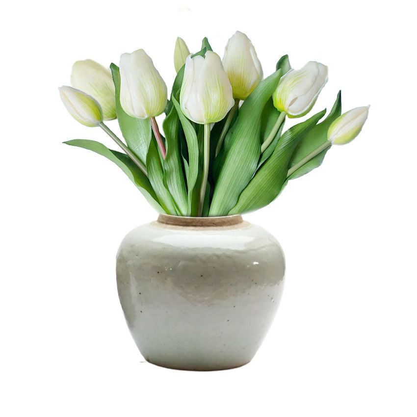 Long a symbol of love, this real touch faux tulip bouquet in white features lifelike petals and lush green leaves for timeless floral elegance.