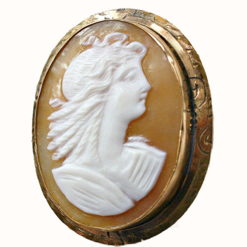 Hand carved shell cameo brooch with classical female portrait, antique style jewelry in unmarked gold setting, refined collectible estate piece.