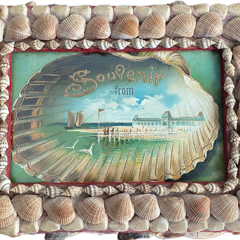 Close-up of antique chromolithograph beneath glass on a seashell souvenir box