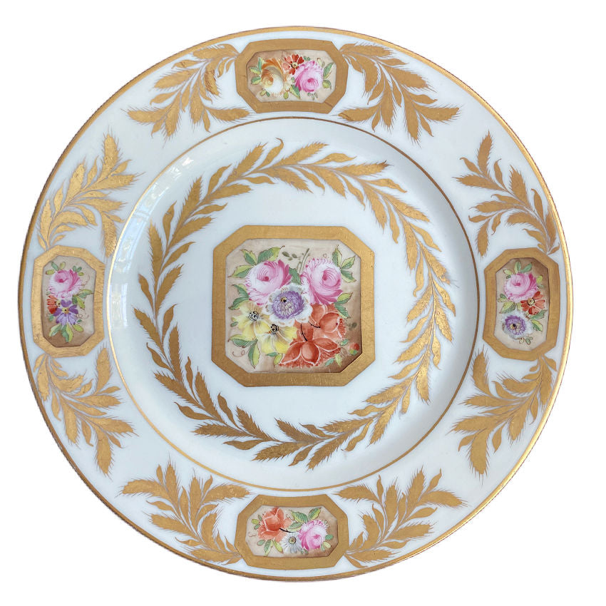 Hand painted Porcelaine de Paris plate with eight sided floral medallion center and gilt rim