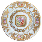 Porcelaine de Paris hand painted floral plate with gilt rim and rose cartouche detail