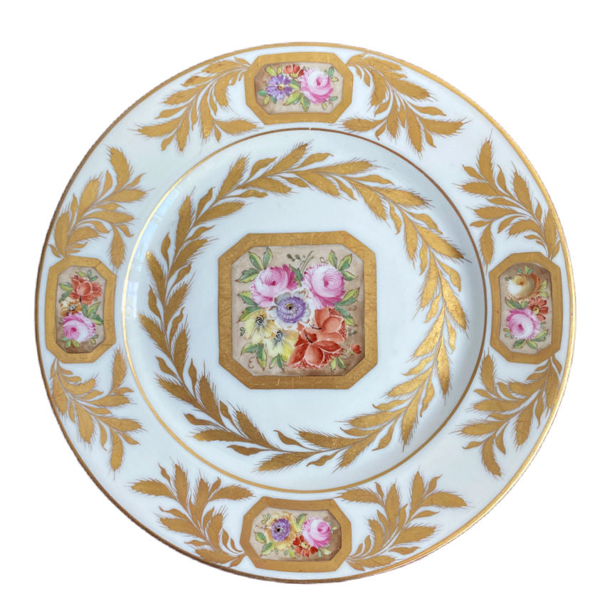 Hand painted French porcelain plate with gilt edge and detailed floral arrangement by Porcelaine de Paris