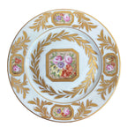 Hand painted French porcelain plate with gilt edge and detailed floral arrangement by Porcelaine de Paris