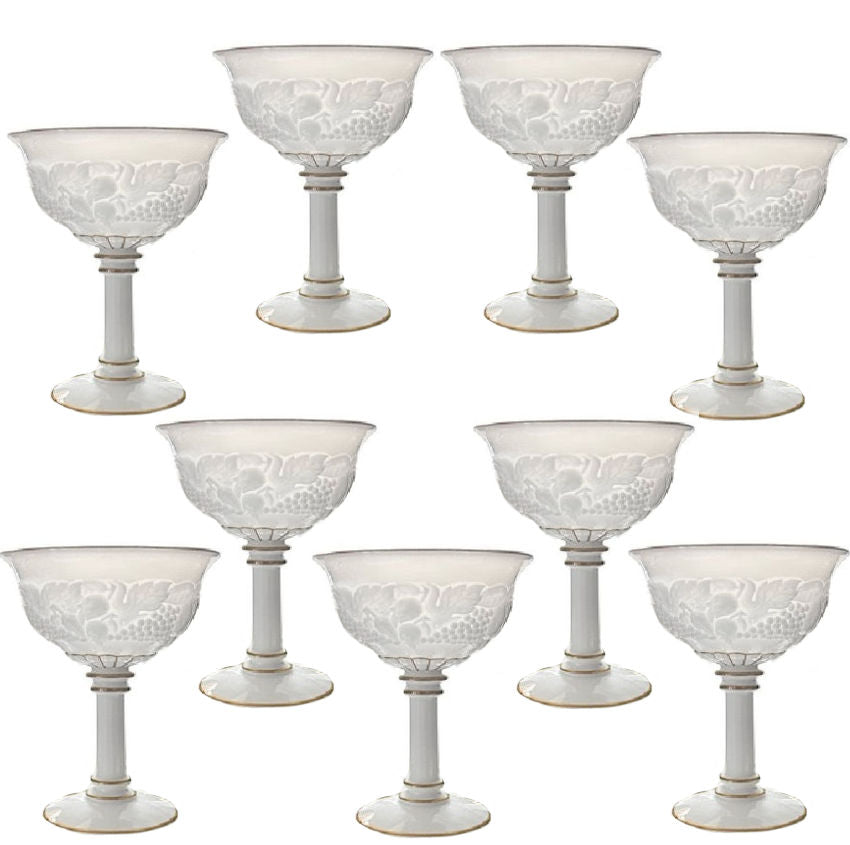 Set of 9 vintage Westmoreland Della Robbia milk glass sherbet glasses with gold trim, featuring classic fruit and floral relief design.