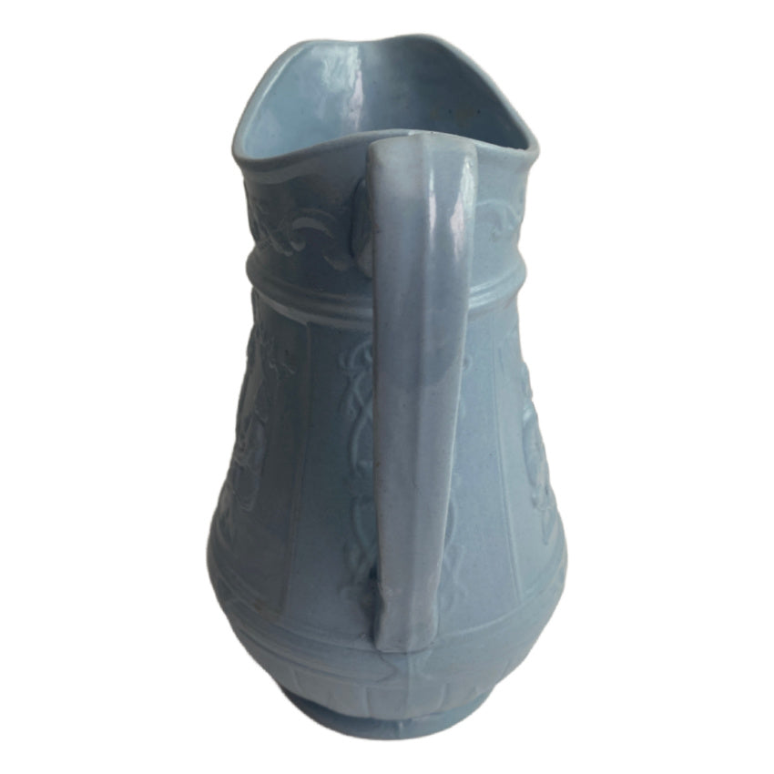 Antique molded pale blue pottery pitchers handle