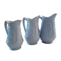 Set of three antique pale blue graduated pitchers
