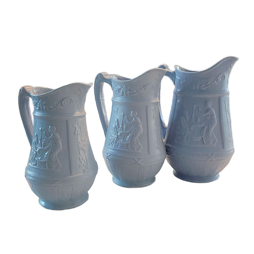 Set of three antique pale blue graduated pitchers