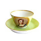 Antique French Sevres Vieux Paris porcelain tea cup and saucer in rare apple green, hand-painted with delicate female portrait and gilt accents. A charming collectible from a European estate, perfect for antique French porcelain enthusiasts.