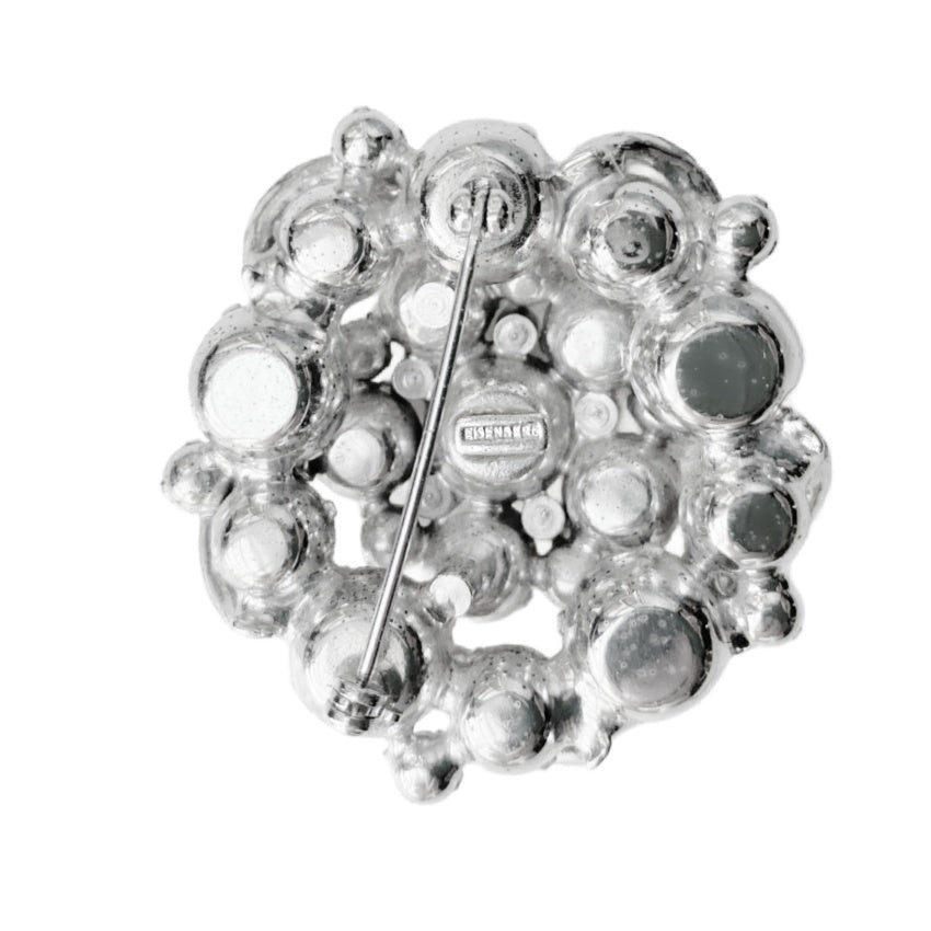 Signed 1940s Eisenberg pavé icing ribbon brooch with brilliant rhinestones in rhodium plating. Iconic vintage statement jewelry, highly collectible design.