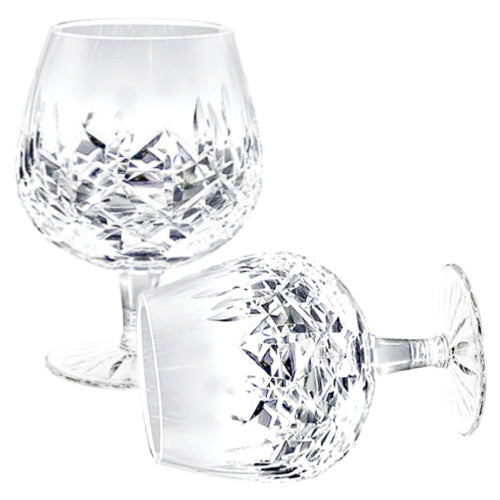 A refined set of four signed Waterford Lismore crystal brandy glasses, beautifully preserved with brilliant diamond and wedge cuts. Timeless Irish craftsmanship for elegant entertaining.
