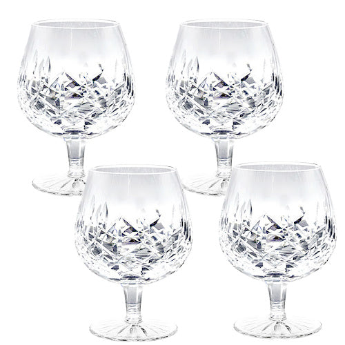 A refined set of four signed Waterford Lismore crystal brandy glasses, beautifully preserved with brilliant diamond and wedge cuts. Timeless Irish craftsmanship for elegant entertaining.