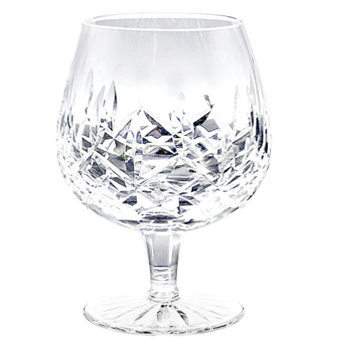 A refined set of four signed Waterford Lismore crystal brandy glasses, beautifully preserved with brilliant diamond and wedge cuts. Timeless Irish craftsmanship for elegant entertaining.