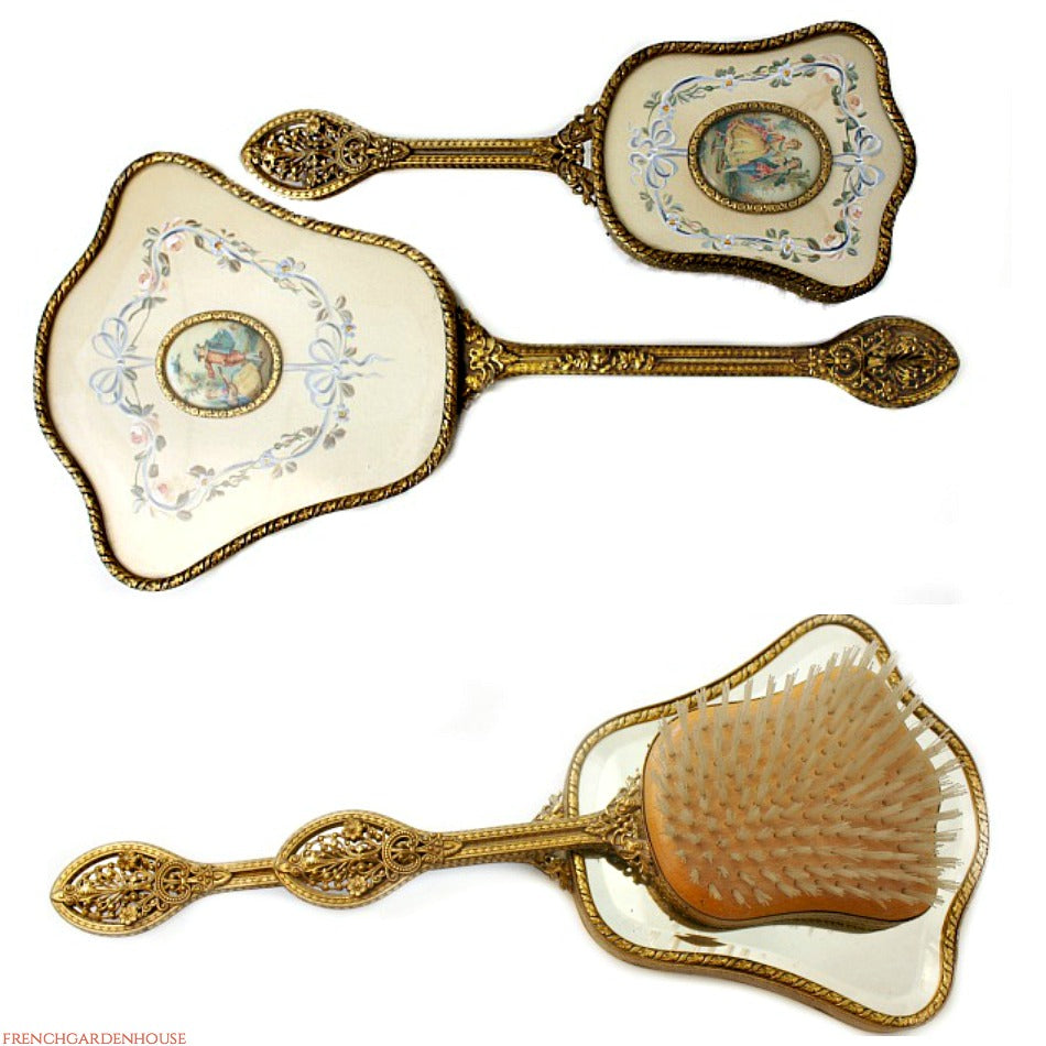 antique vanity mirror and brush, hand painted vanity set, gilt filigree mirror brush, antique mirror and brush set, romantic vanity set, vintage dressing table set, antique vanity accessory, gilt vanity mirror, antique hand mirror, vintage vanity brush, romantic courting scene decor, french style vanity set, antique dressing table accessory, victorian vanity set, antique boudoir accessories, luxury vanity decor, collectible vanity set, antique mirror brush set, ornate vanity mirror, hand painted vanity acce