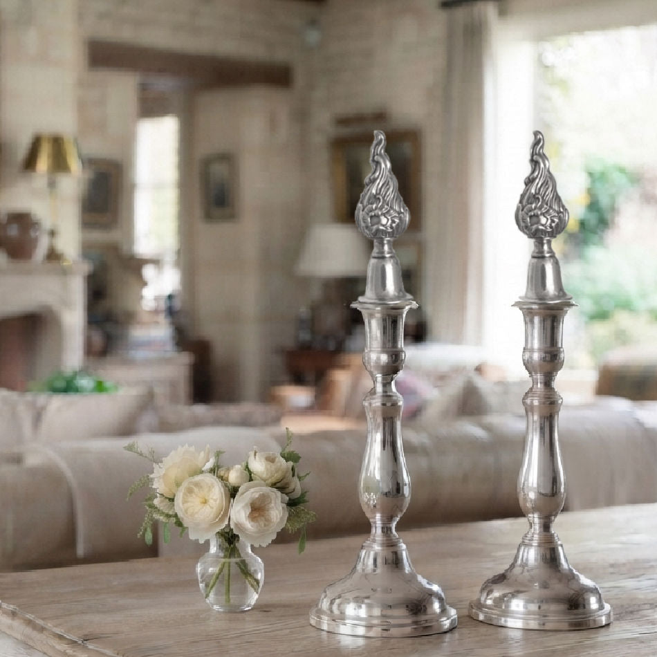 French table setting with silver candlesticks and roses