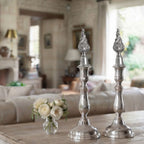 French table setting with silver candlesticks and roses