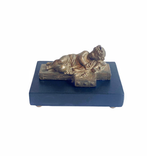 Antique Beaux Arts gilt bronze sleeping cherub on ebonized base