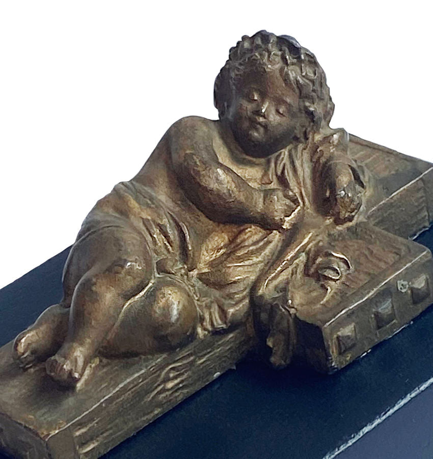 Antique European cherub sculpture with aged gilded patina