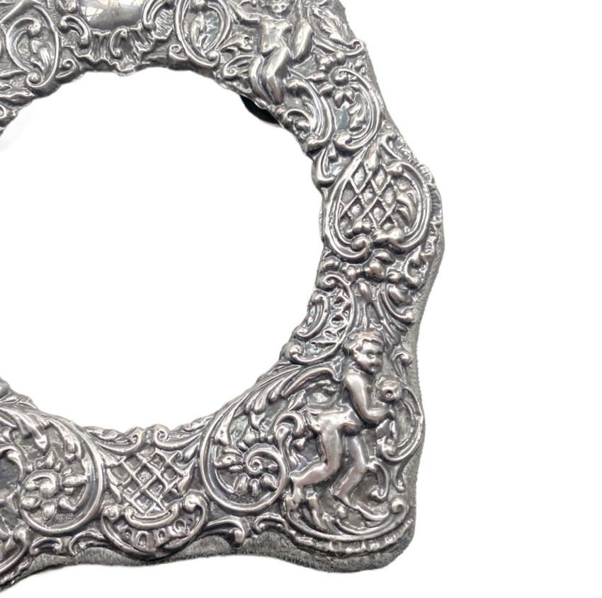 Victorian style silver picture frame with angel cherubs high relief foliage design