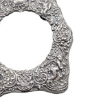Victorian style silver picture frame with angel cherubs high relief foliage design