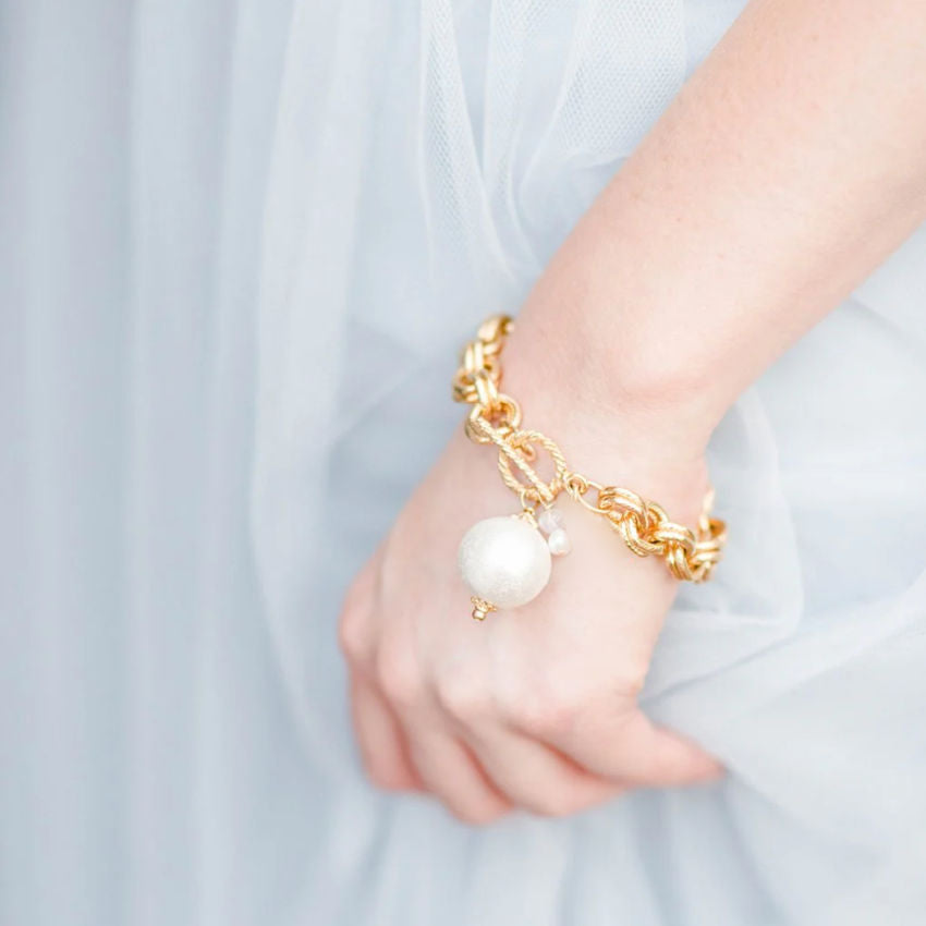 Classic for every day or special occasions. Gorgeous cotton pearl dangle accented by a crystal & freshwater pearl. 24 kt triple gold plating.