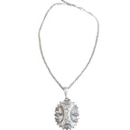 Antique English silver and rose gold locket necklace with Victorian charm. A timeless sentimental heirloom jewelry piece with historic elegance.