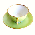 Antique French Sevres Vieux Paris porcelain tea cup and saucer in rare apple green , hgilt accents, showing the handle. 