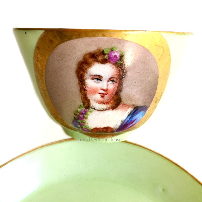 Antique French Sevres porcelain tea cup and saucer in rare apple green, hand-painted female portrait with pink rose in hair and on her dress, pearls.