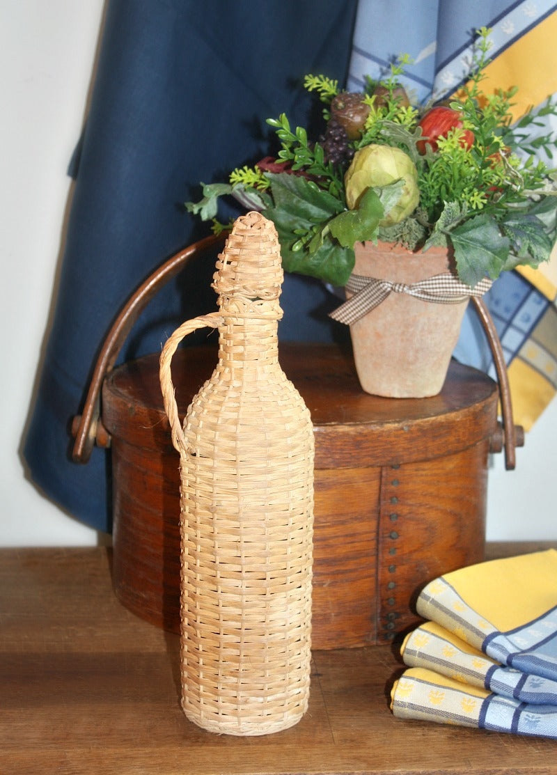 antique French wicker wine bottle