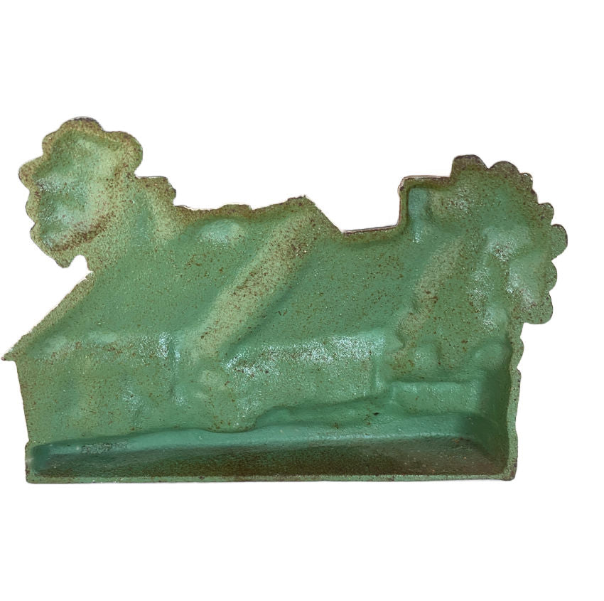 Back view of 1920's Hubley cottage doorstop with climbing roses cast iron garden scene