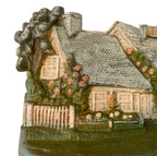 Vintage Hubley doorstop floral cottage design with garden detail