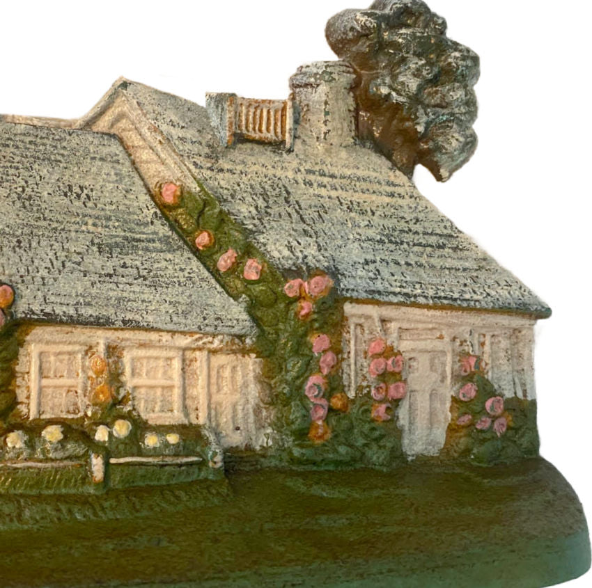 Early 20th century cast iron cottage doorstop with rose relief