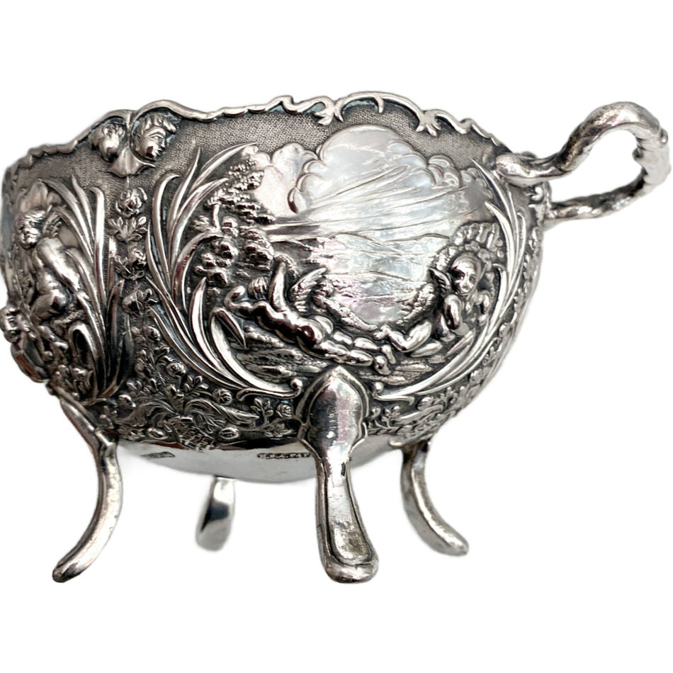 Vintage silver plated footed bowl showing ornate raised decoration