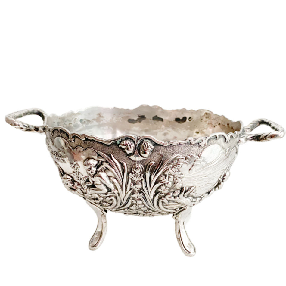 Vintage silver plated footed bowl with cherub and floral relief