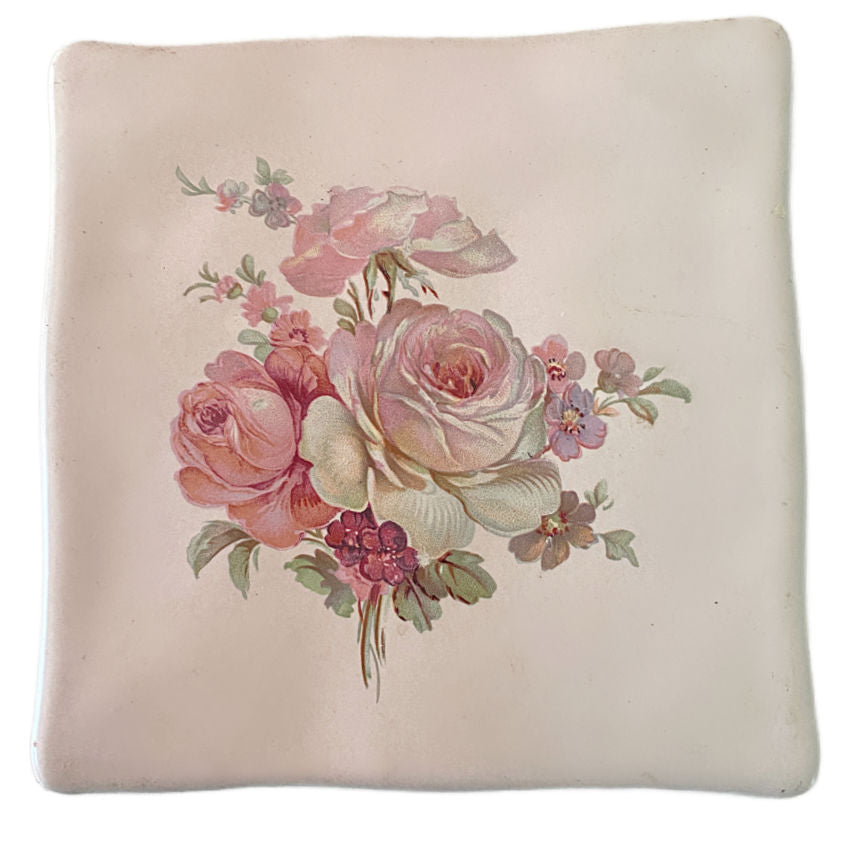 An exquisite vintage Wenczel ceramic tile adorned with a soft pink rose. A romantic collectible that adds timeless elegance and refined charm to any luxurious interior.