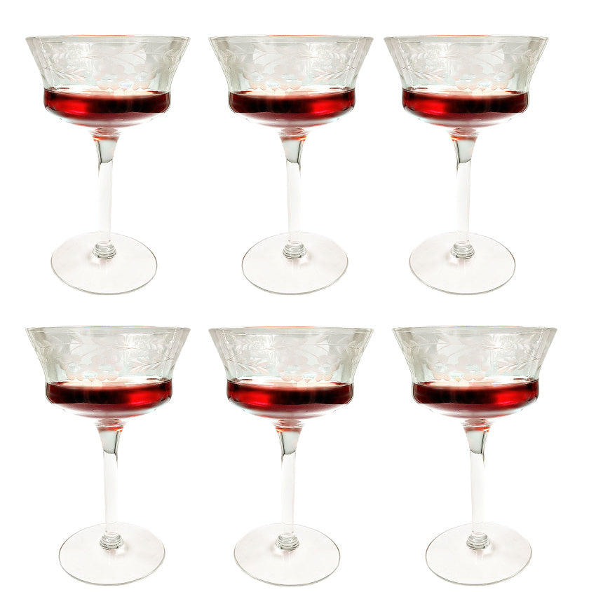 Elegant set of six vintage etched floral cocktail coupes with flared bowls. Delicate, heirloom-style glassware perfect for refined entertaining and celebrations.