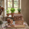 Vintage French basket styled with bread and linens in a French Country kitchen