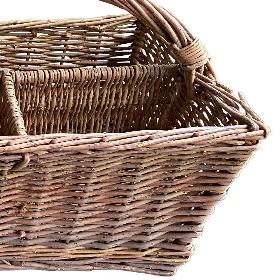 Vintage divided country basket showing its hand-woven interior compartments.