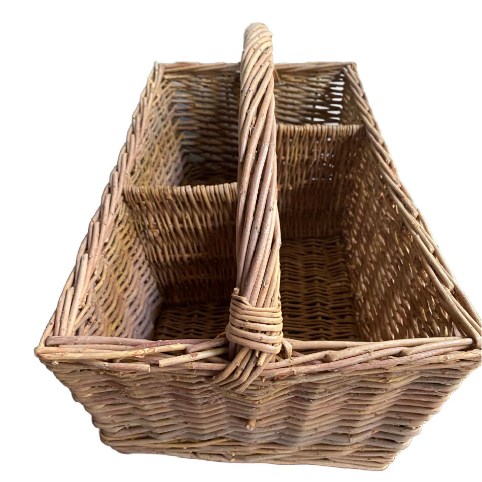 Side view of a vintage hand-woven divided basket with traditional country styling.