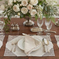 Vintage Marghab Ponto Grega embroidered linen placemats styled on an elegant dining table