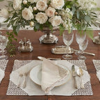 Vintage Marghab Ponto Grega embroidered linen placemats styled on an elegant dining table