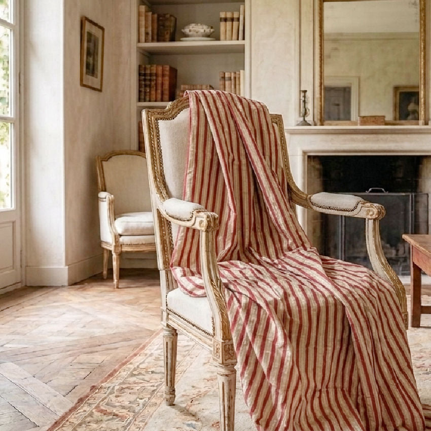 Vintage Scalamandré silk velvet fabric draped over Louis XVI chair in elegant French interior