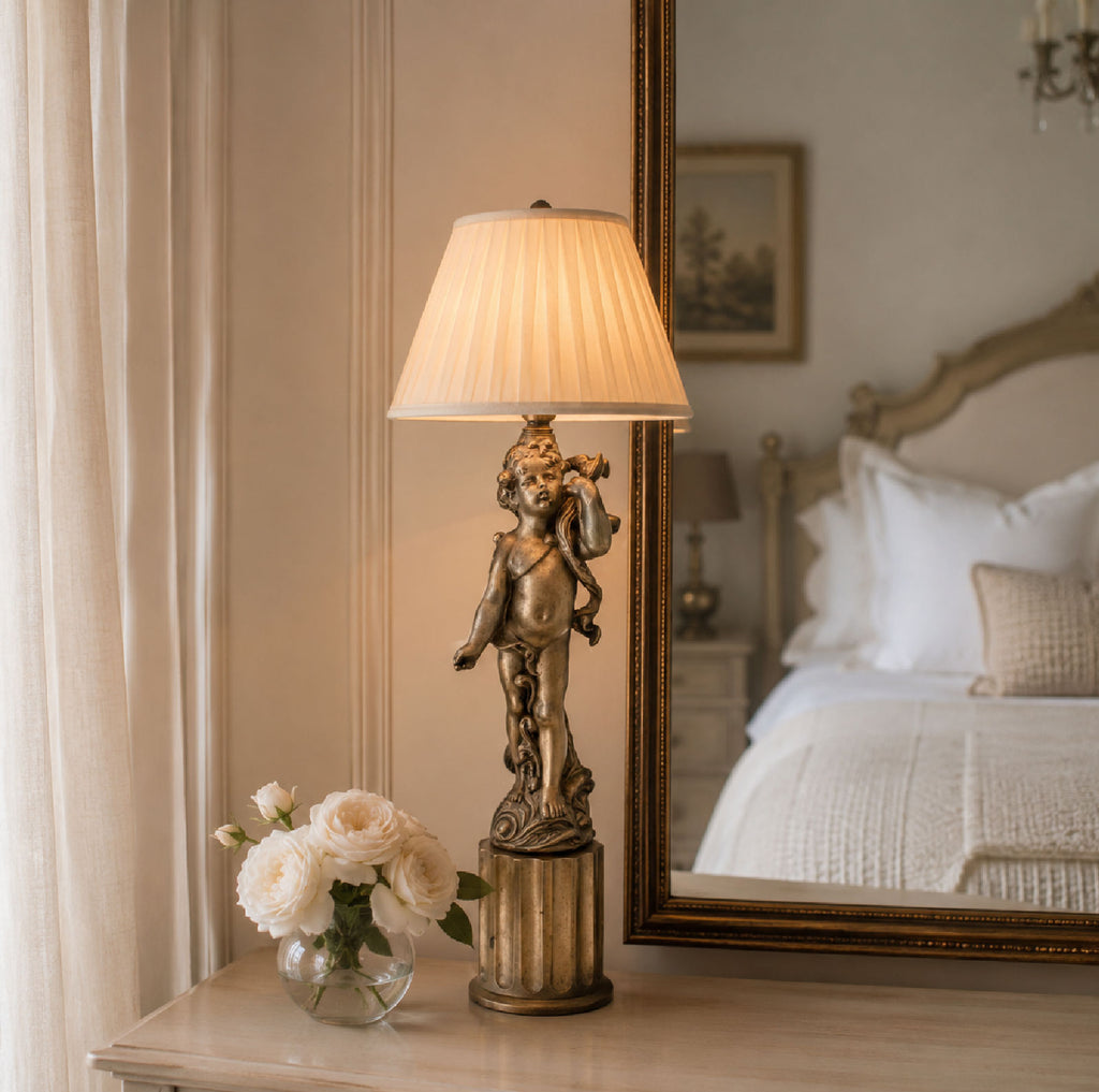 styled bedroom with vintage cherub lamp