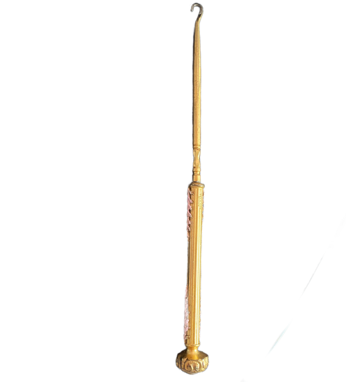 Elegant antique button hook by Apollo Studios showing gold-plated finish and enamel detail