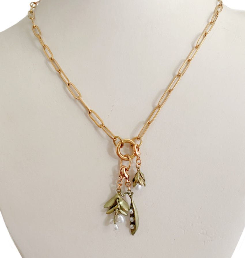 Layered jewelry look with cast bronze vine charm and freshwater pearls, romantic botanical collectible design
