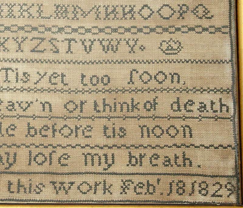 Antique 1829 English sampler in original frame, hand-stitched with alphabet, numbers, and hymn by Sarah Ash. Ready-to-display historic embroidery.